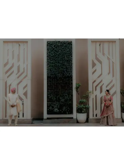 A minimalist wide shot of the couple, their distance from each other creating a modern and stylish composition.