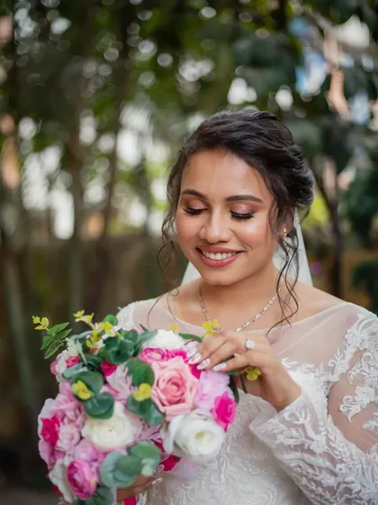 A close-up on that subtle, glowy makeup. This look is always a winner, creating a fresh and timeless bridal style.