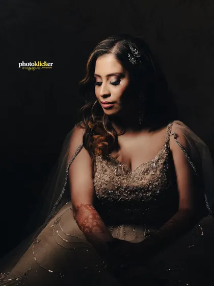 A soft, elegant portrait of the bride-to-be, her expression serene and her gown beautifully detailed.