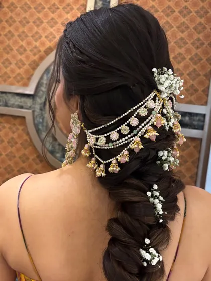 This side angle shows how the multi-layered hair jewelry drapes beautifully over the thick braid. Learning to select and place accessories is a key part of my curriculum.