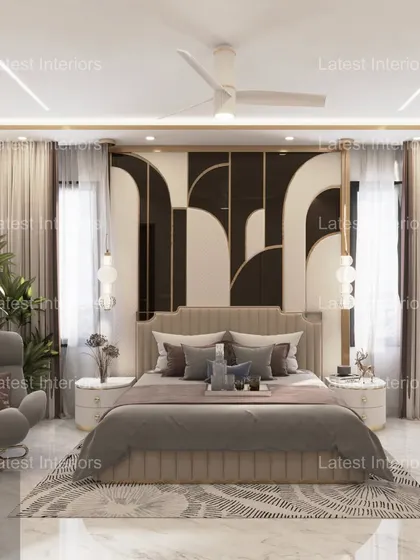 A luxurious master bedroom featuring a bold, geometric headboard in black and white. The room is designed for serenity and style, with a comfortable armchair and a dedicated study area.