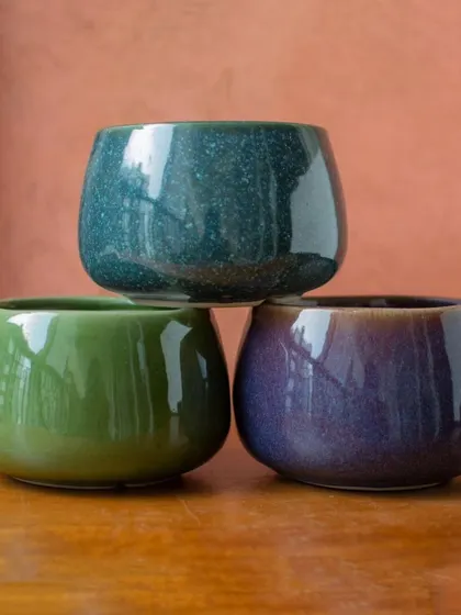 My mini ceramic planters come in a variety of rich, jewel-toned glazes. They are perfect for creating a colorful collection of succulents or small plants.