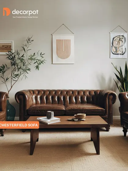 The classic Chesterfield sofa, with its deep button tufting and rolled arms, brings a touch of timeless sophistication to this living room. It's a statement piece that never goes out of style.