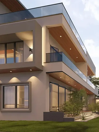 The rear view of 'The Honest House' in Coimbatore. This angle shows the deep, shaded balconies and the integration of a small garden with a Buddha statue, creating a private and peaceful outdoor space.