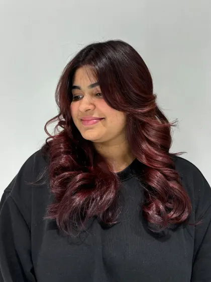 A stunning auburn hair color transformation. This shade is a beautiful blend of red and brown for a warm, fiery look.