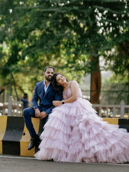 A sweet, relaxed moment from the same shoot. The full, ruffled skirt of the gown creates a beautiful shape even when seated.