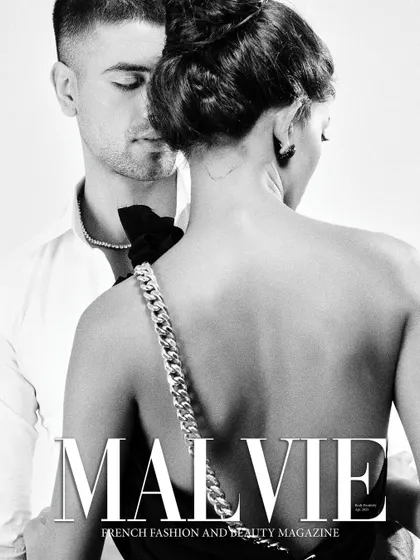 A black and white cover for Malvie Magazine, focusing on the back of the dress and the intimacy between the couple.