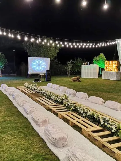 We transform any location into a beautiful dining experience. This elegant sit-down arrangement by the pool was for a private farmhouse party in Nashik, showing our capability to handle destination event catering with style.