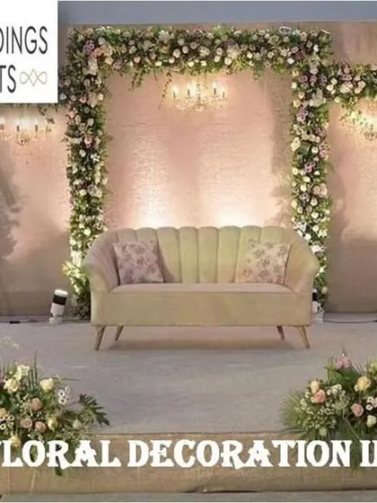 This promotional image highlights our expertise in floral decoration in Bangalore, showing a lavish stage fully adorned with white and pastel flowers, demonstrating our ability to create grand and immersive environments.