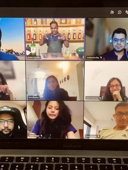 The virtual bar is open. A full screen of enthusiastic participants on a video call, ready to learn, shake, and sip.