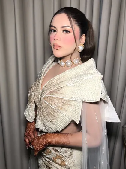 Another angle of the client, her confidence shining as brightly as her pearls.