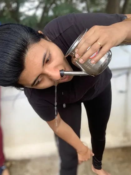 A student demonstrates Jala Neti, another kriya using a neti pot to cleanse the sinuses.