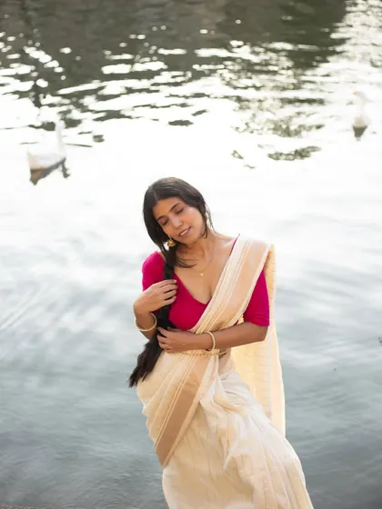 A serene, expressive portrait in a silk saree, highlighting the soft fabric and my ability to convey a gentle, feminine mood for ethnic wear brands.