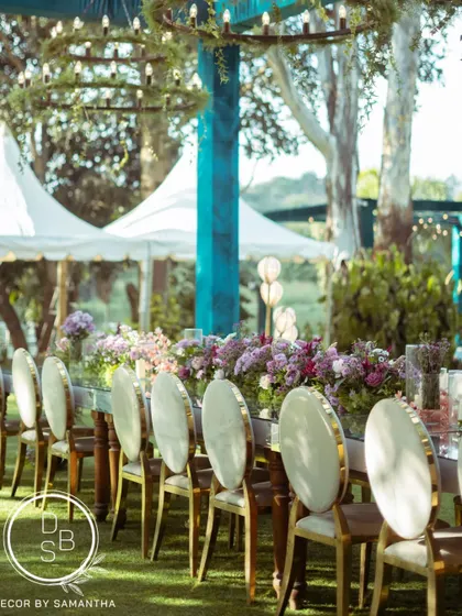 A side view of the stunning mirrored long table. The reflection of the sky and surrounding greenery on the tabletop created a truly magical effect for the reception dinner.