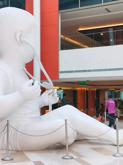 A different angle of the monumental baby sculpture at Fortis Hospital, Gurgaon. Its placement in the open, multi-story lobby makes it visible from various levels.