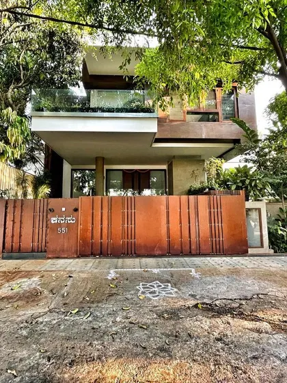 The Corten steel gate and surrounding greenery of Kanasu, a project that is camouflaged into its natural surroundings, offering pure bliss.