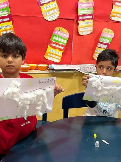 Spring camp is where learning is fun. Here, children are showing off their fluffy sheep crafts made with cotton.