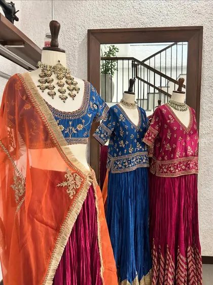 A display of colorful lehenga and sharara sets. I love helping clients play with bold colors like royal blue, fuchsia, and orange to create a joyful and festive wardrobe.