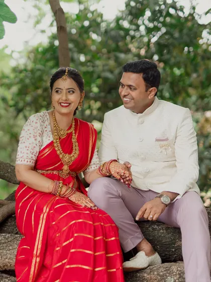 A sweet, candid moment between a couple sitting together in nature. The genuine smiles and easy interaction are what we strive to capture in our couple photography.
