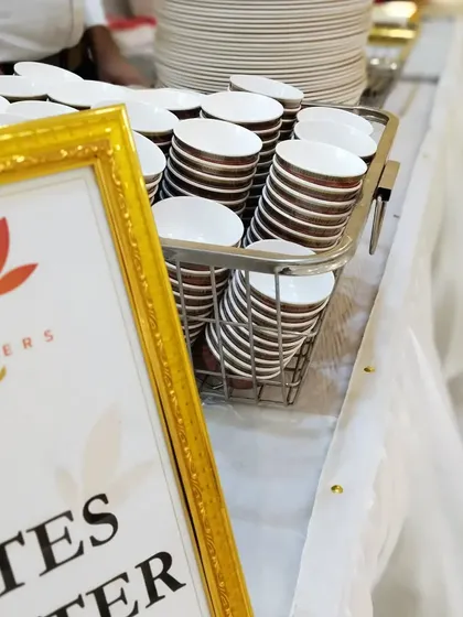 A behind-the-scenes look at our plate counter, with bowls and plates neatly stacked and ready for service. Organization is key to a successful event.