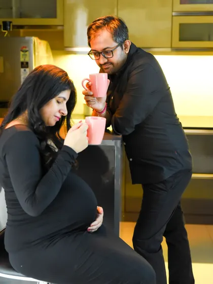 Sometimes the most special moments happen right at home. This lifestyle maternity session captures a quiet, everyday moment in the couple's kitchen, proving that you don't need a fancy location to create beautiful memories.