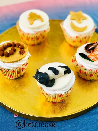 A collection of my Bakrid theme cupcakes. I had so much fun creating these unique toppers, including a sheep, prayer beads, and even a miniature cupcake version of biryani.
