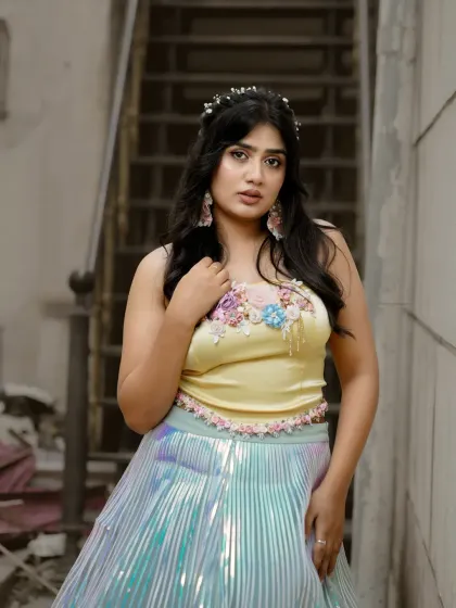 A close-up of the same look, focusing on the floral details of the top.