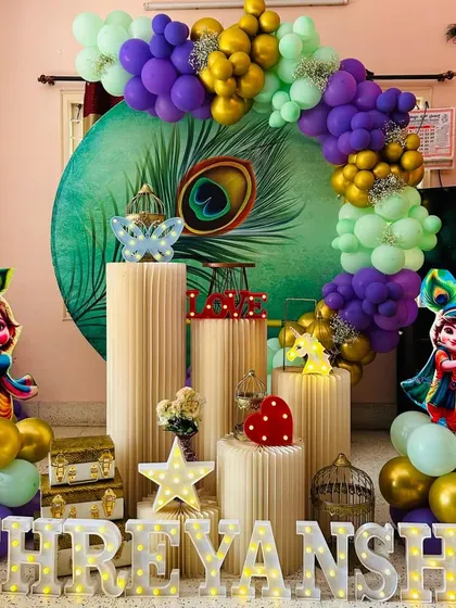 For a touch of tradition and fun, we offer a Little Krishna theme. This setup for Shreyansh includes a beautiful peacock feather backdrop, cutouts of baby Krishna, and a vibrant color scheme.