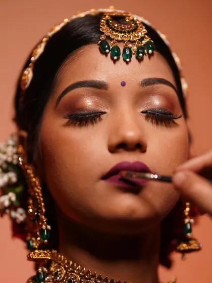 The art is in the details. A steady hand and the right brush are key to creating the perfect bold lip. We guide our students through every step to achieve crisp, defined, and long-lasting lip color.