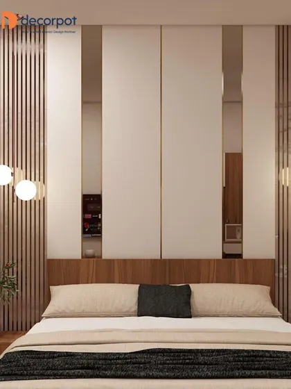 A modern bedroom with a wooden headboard and a back panel featuring vertical fluting and mirrored strips. The globe pendant lights add a soft, contemporary touch.