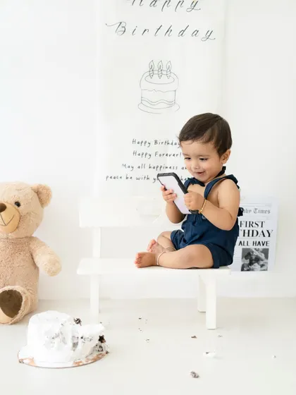 A candid moment after the cake smash is over. Even the post-cake moments are full of cute expressions and photo opportunities.