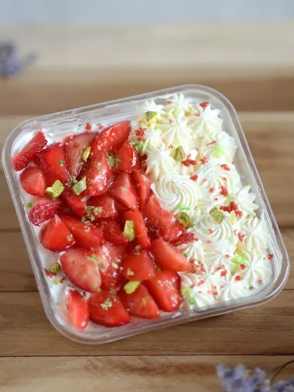 A beautiful Strawberry and Pistachio dessert box. Layers of cream and fresh strawberries make this a light, refreshing, and elegant treat to celebrate the special women in your life.