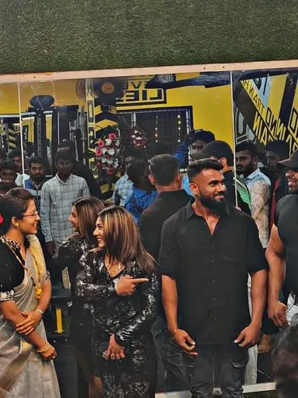 Interacting with guests and members at a gym event. I believe in being approachable and sharing knowledge.