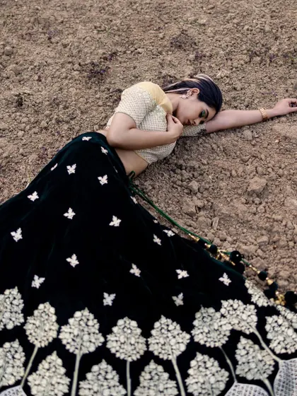 An artistic shot from the same series. The makeup is durable and stays flawless even in unconventional poses and settings.