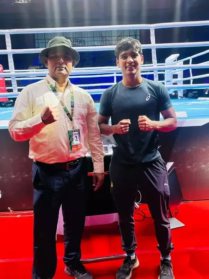 With one of my boxers at a major tournament venue. I am there with my athletes every step of the way, from the local gym to the national stage.