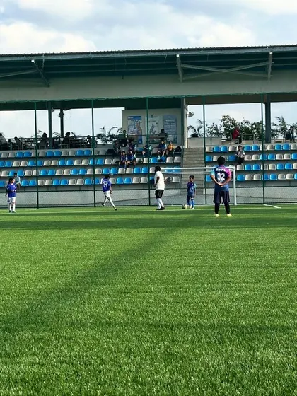 A wide view of our training ground, with players engaged in various drills under the watchful eyes of our coaches.