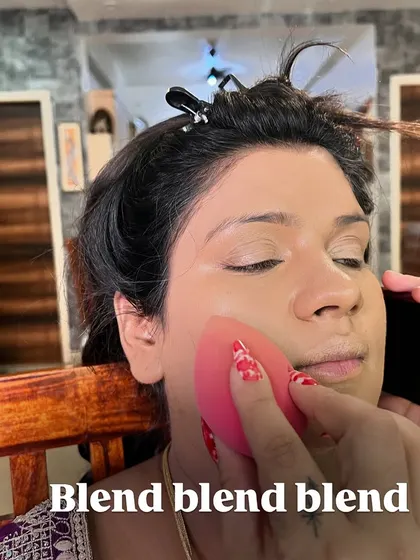 The key to flawless makeup is to blend, blend, blend. This shot shows the process of seamlessly blending the foundation for an even and natural-looking base.