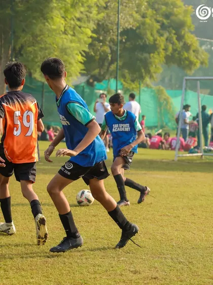 Players in blue training bibs during a practice session.