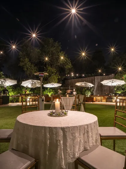 An intimate table setting for two under the stars, perfect for the couple to share a quiet moment during their reception.