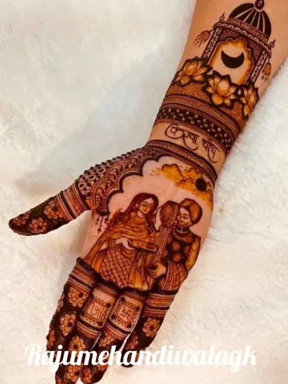 Here, the Karwa Chauth story is told on a single hand. The palm shows a couple portrait, while the wrist area depicts the moon and kalash, with 'Karwa Chauth' written in Hindi.