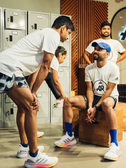Another angle of our coaching interaction. I ensure every runner gets the personal attention they need.