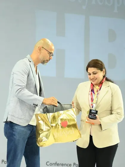 Receiving an award and prize at the HBS 2025 competition. This image showcases the prestige and recognition that comes with being part of the SoBo Nail Salon network.