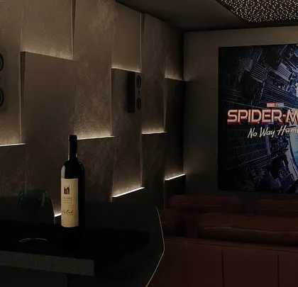 The perfect movie night setup: a great film on a huge screen, comfortable seating, and a bottle of wine ready at the integrated bar.
