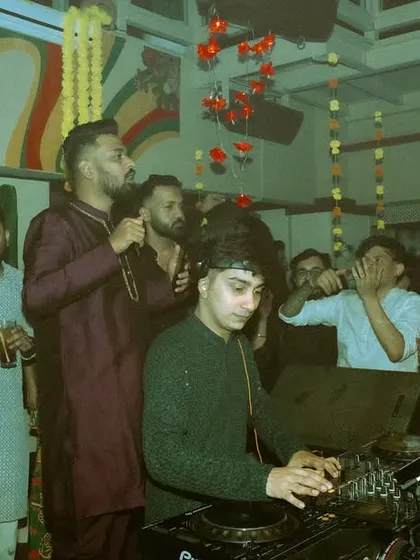 The vibe at the Diwali party was just perfect. This photo shows the crowd and my friends on stage enjoying the music and the festive atmosphere.