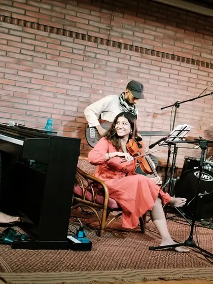 Another angle of REFUGE in their element during the Jazz Festival. The warm lighting and brick backdrop create a classic jazz club vibe right here at Koota.