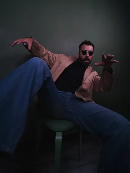 Bringing some dynamic energy to a seated pose. This kind of expressive movement works well for fashion shoots that need to feel alive and engaging.