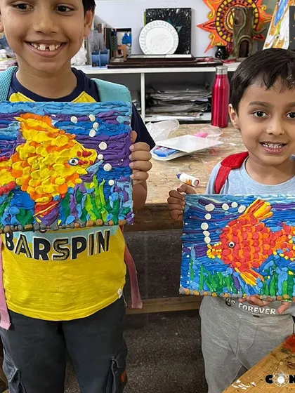 These two friends are thrilled with their playdough fish scenes. It's so rewarding to see them build confidence together as they master new creative skills.