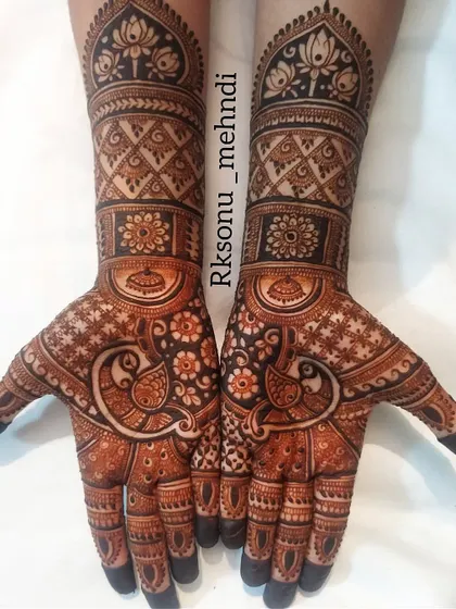 A beautiful semi-bridal design that balances intricate patterns with open space. This theme-based art features peacocks and lotus motifs, perfect for any wedding celebration.