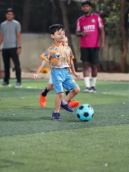 A young player dribbles with confidence, a skill developed through our consistent and dedicated coaching.