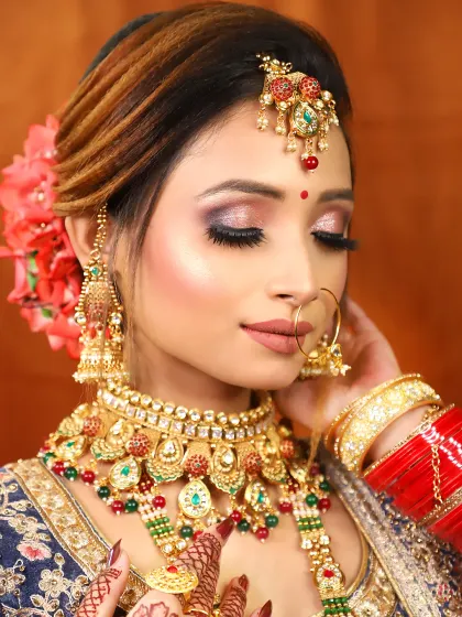 A close-up of a glittery pink and purple eyeshadow look. This is a fun and glamorous choice for a sangeet or reception.